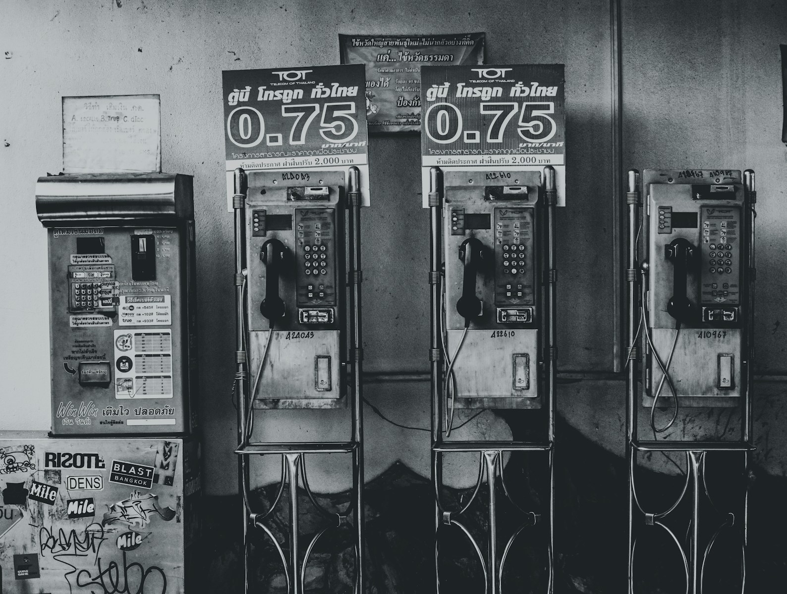 gray-scale photo of telephones