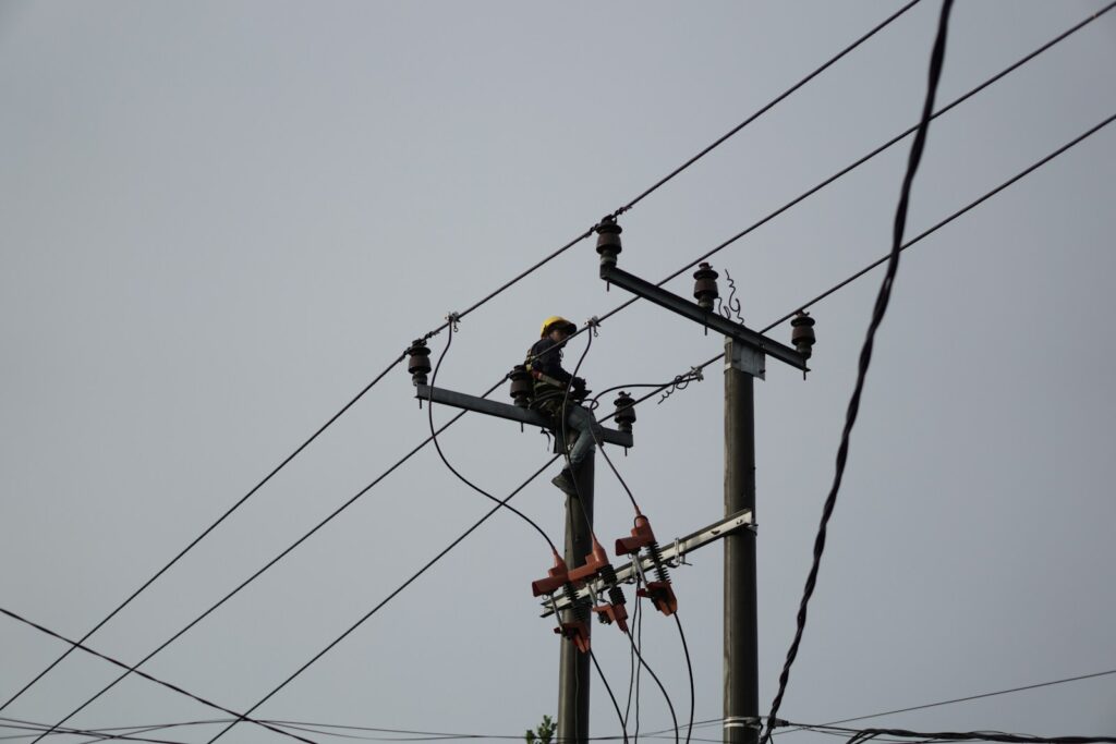 a man on a high voltage power line