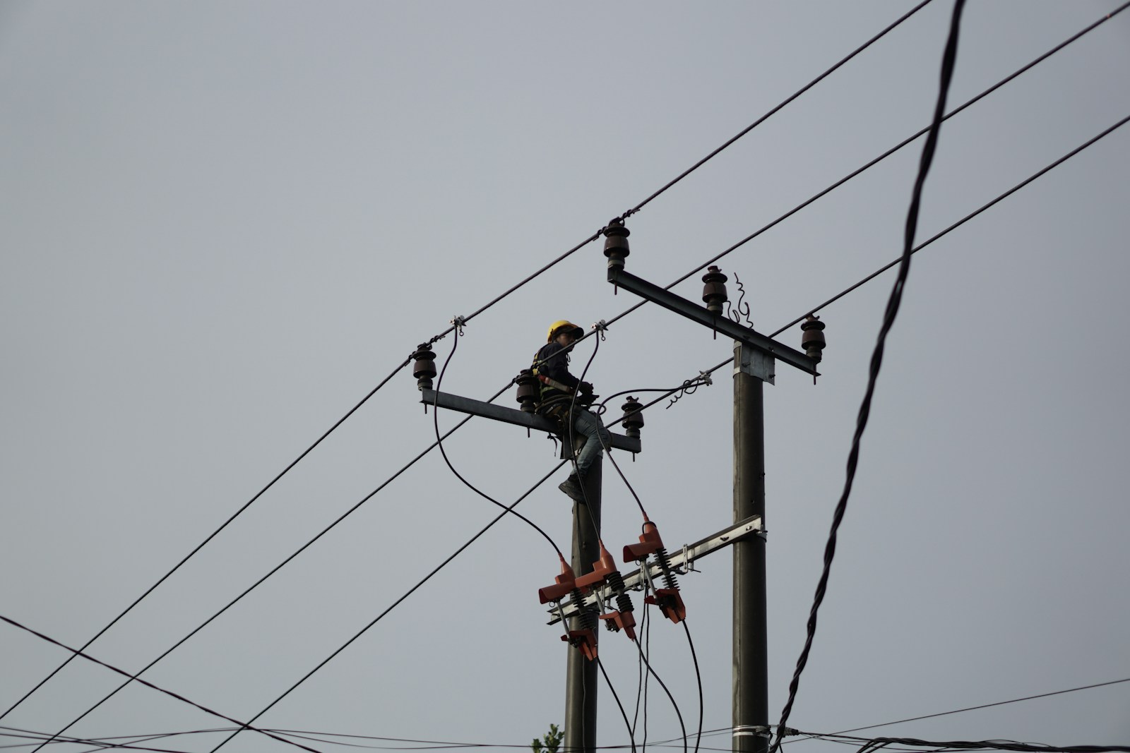 a man on a high voltage power line